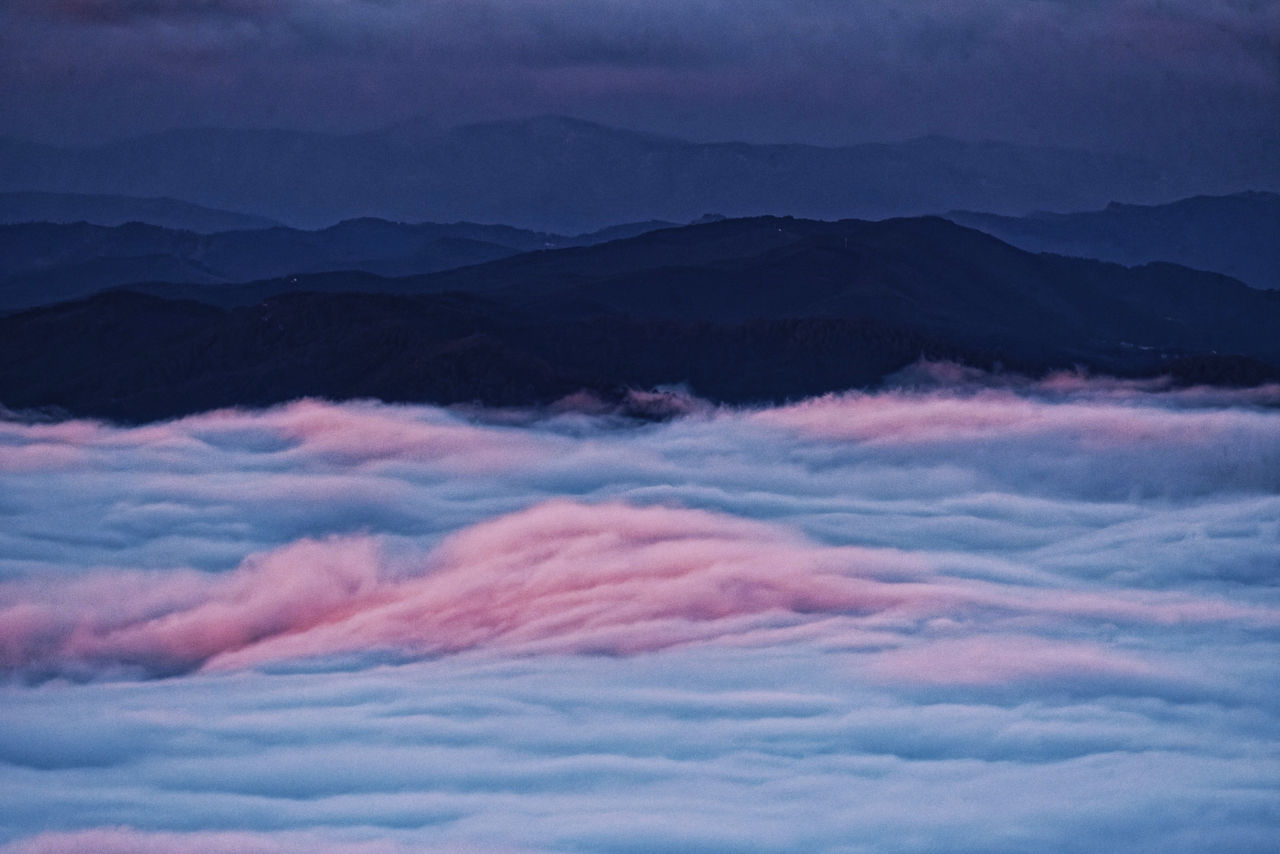 SCENIC VIEW OF MOUNTAINS AGAINST SKY DURING SUNSET