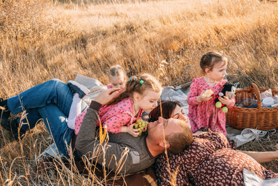 Quality family time, triple the fun with triplets on a nature picnic on a warm autumn day