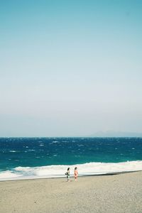 Scenic view of sea against blue sky