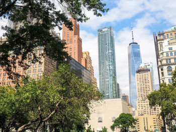 Skyscrapers in city against sky