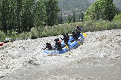 People rafting on river