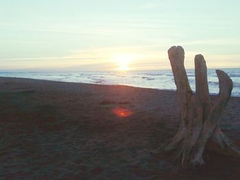 Scenic view of sea against sky at sunset