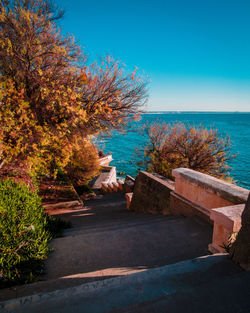 Scenic view of sea against clear blue sky