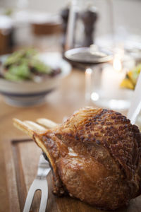 Close-up of pork on table in restaurant