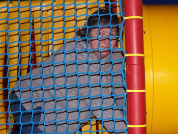 Portrait of mature woman in jungle gym