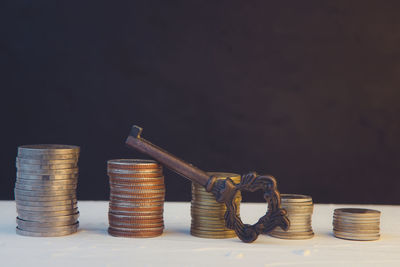 Stack of objects on table against black background