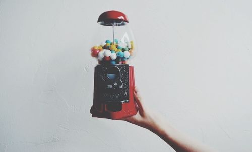 Close-up of red balloon over white background