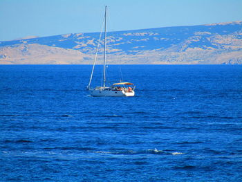 A sailboat in the adriatic sea along the coast of the rab island 