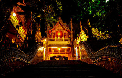 Low angle view of illuminated building at night