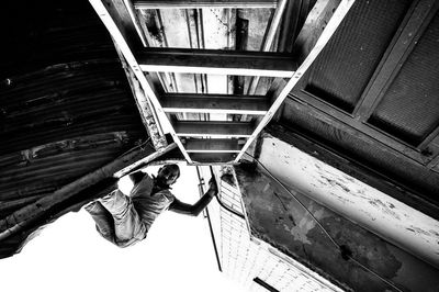 Full length of woman standing in front of building