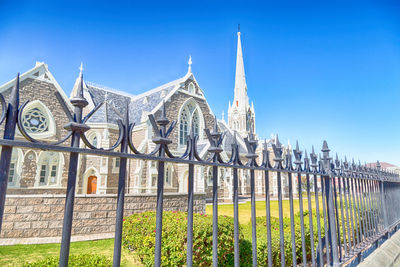 Exterior of temple against clear blue sky