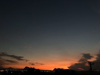 Silhouette trees against sky during sunset