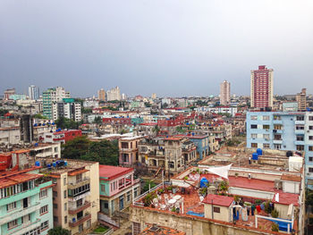 High angle view of buildings in city against clear sky