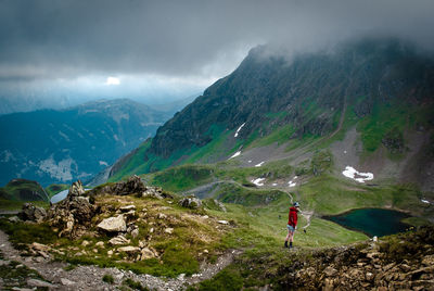 Man on mountain against sky