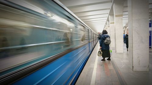 Rear view of people at subway station