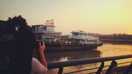 People in river at sunset