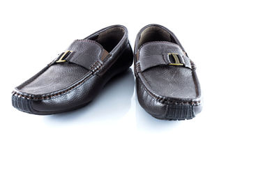 High angle view of shoes on floor against white background