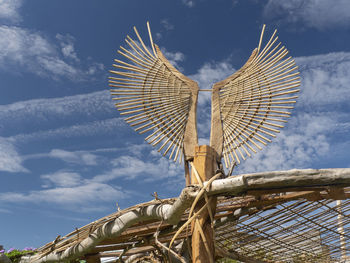 Low angle view of metallic structure against sky