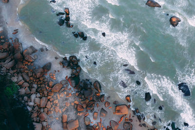 Directly above view of rocks at beach