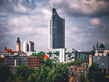 Modern buildings against sky in city