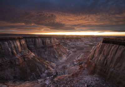 Epic sunrise aerial panorama above massive coal mine canyon on n