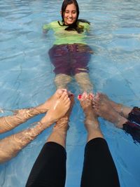 Low section of woman in swimming pool
