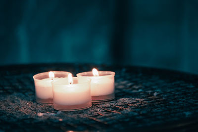 Close-up of lit tea light candles