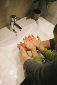 Father with child washing hands