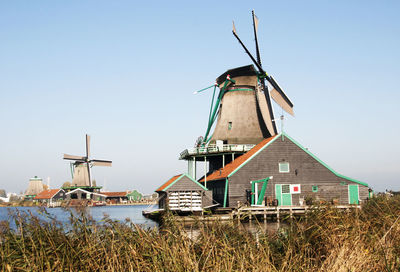 Low angle view of windmill against clear sky