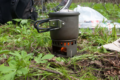 Close-up of camping stove on field