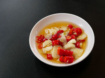 High angle view of fruit salad in bowl on table