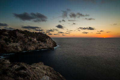 Scenic view of sea against sky at sunset