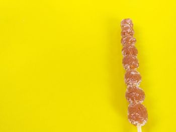 Close-up of ice cream against yellow background