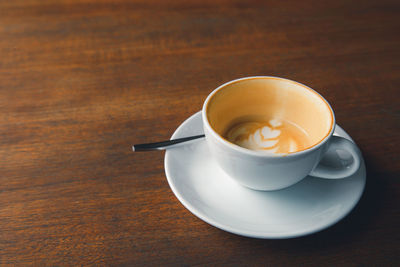 High angle view of coffee cup on table