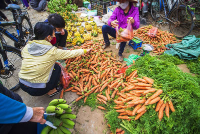 People at market stall