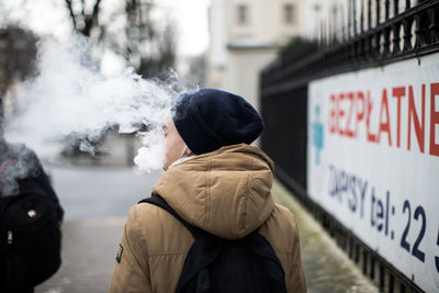 Close-up of woman smoking outdoors