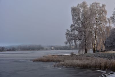 Scenic view of frozen landscape against clear sky