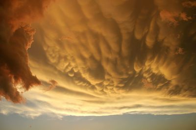 Scenic view of cloudy sky at sunset