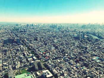 High angle view of crowd and buildings against sky