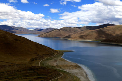View of lake against cloudy sky