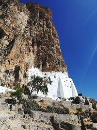 Low angle view of rock formations against sky