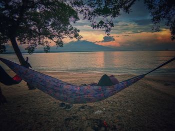 Scenic view of beach against sky during sunset