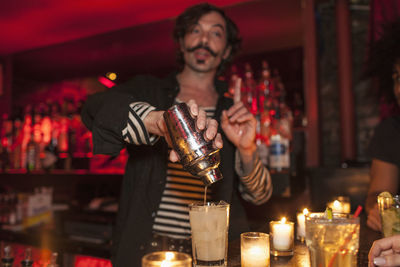 Young man holding ice cream cone