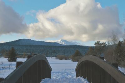 Scenic view of snow covered mountains against sky