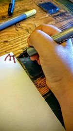 Close-up of pencil on wooden table