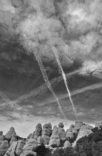 Low angle view of rock formation against sky