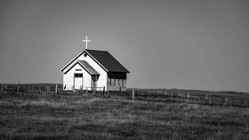 House on field against sky