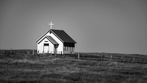 House on field against sky