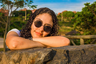 Portrait of young woman wearing sunglasses