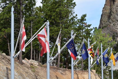 Multi colored flags hanging on clothesline